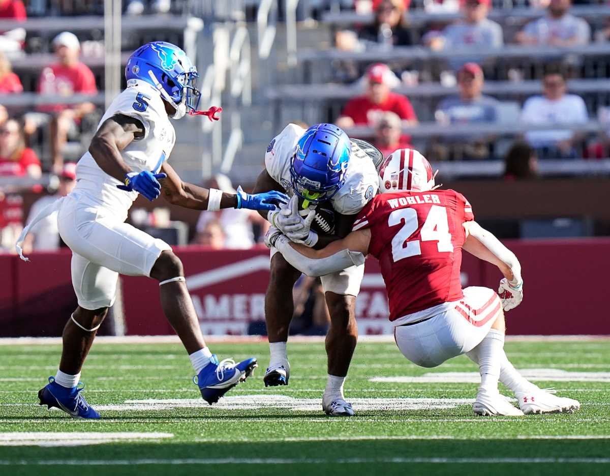 Wisconsin safety Hunter Wohler (24) tackles Buffalo running back Ron Cook Jr. (2) during the third quarter of the game on Saturday September 2, 2023 at Camp Randall Stadium in Madison, Wis.